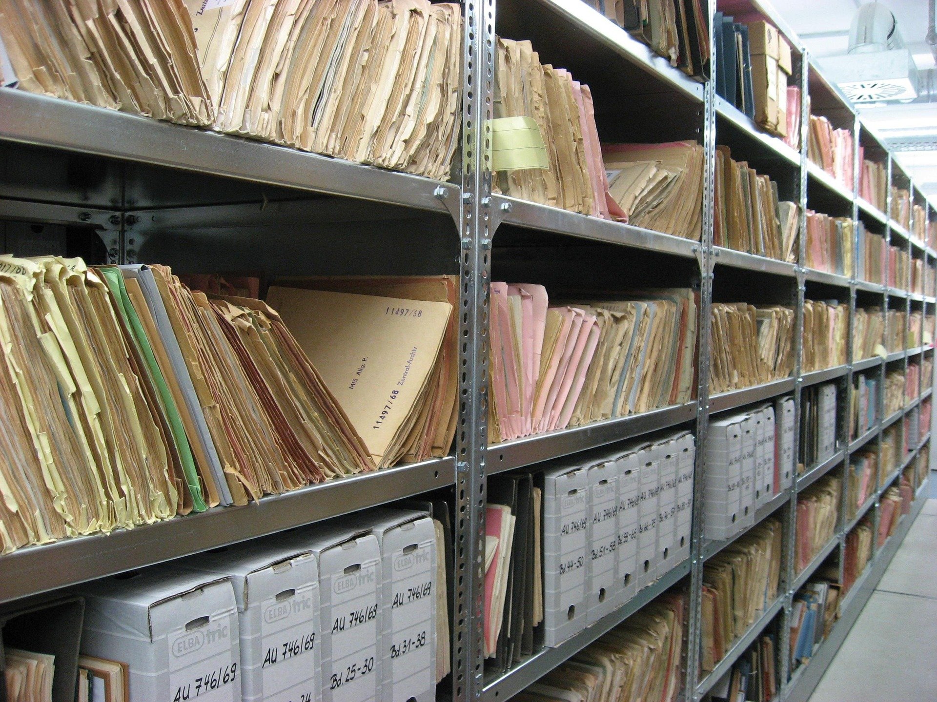 Rows of archived historical property and land title records spanning decades